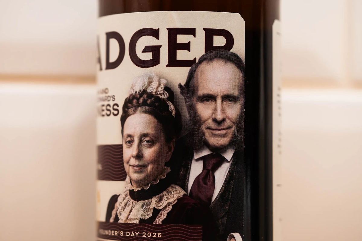 Close-up of the Founder's Day 2026 label with portraits of Hannah and George Edward