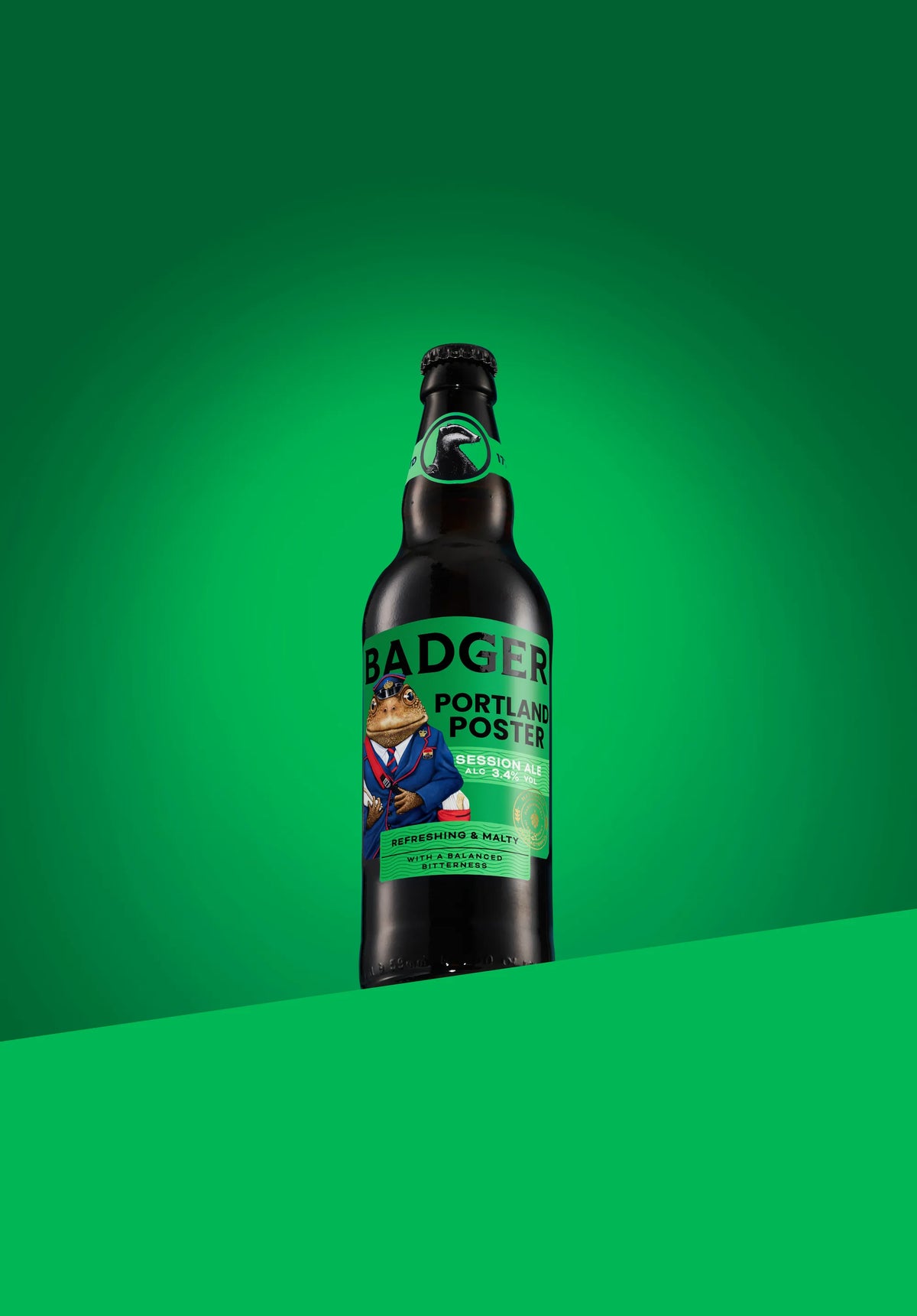 Bottle of Badger Portland Poster session ale on a green background