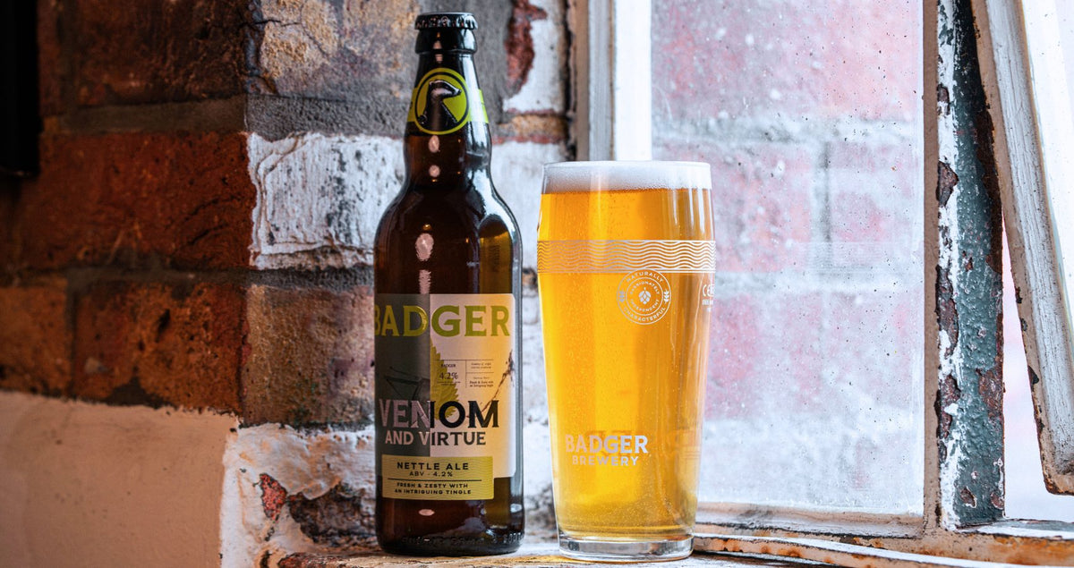 Bottle and pint of Badger Venom and Virtue nettle ale on a stone window ledge