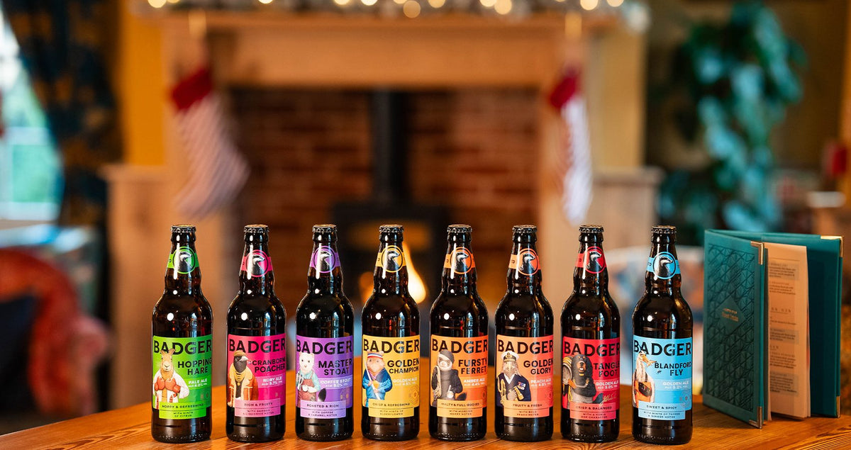 Line-up of Badger bottles on a mantelpiece decorated for Christmas