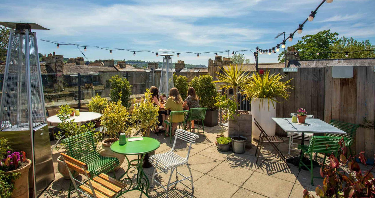 Hall & Woodhouse pub garden terrace strung with festoon lights