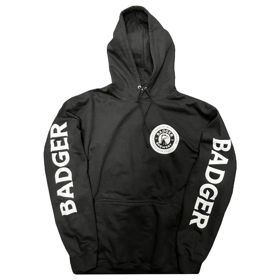 Front of the black Badger hoodie showing the badger roundel logo and Badger sleeve print