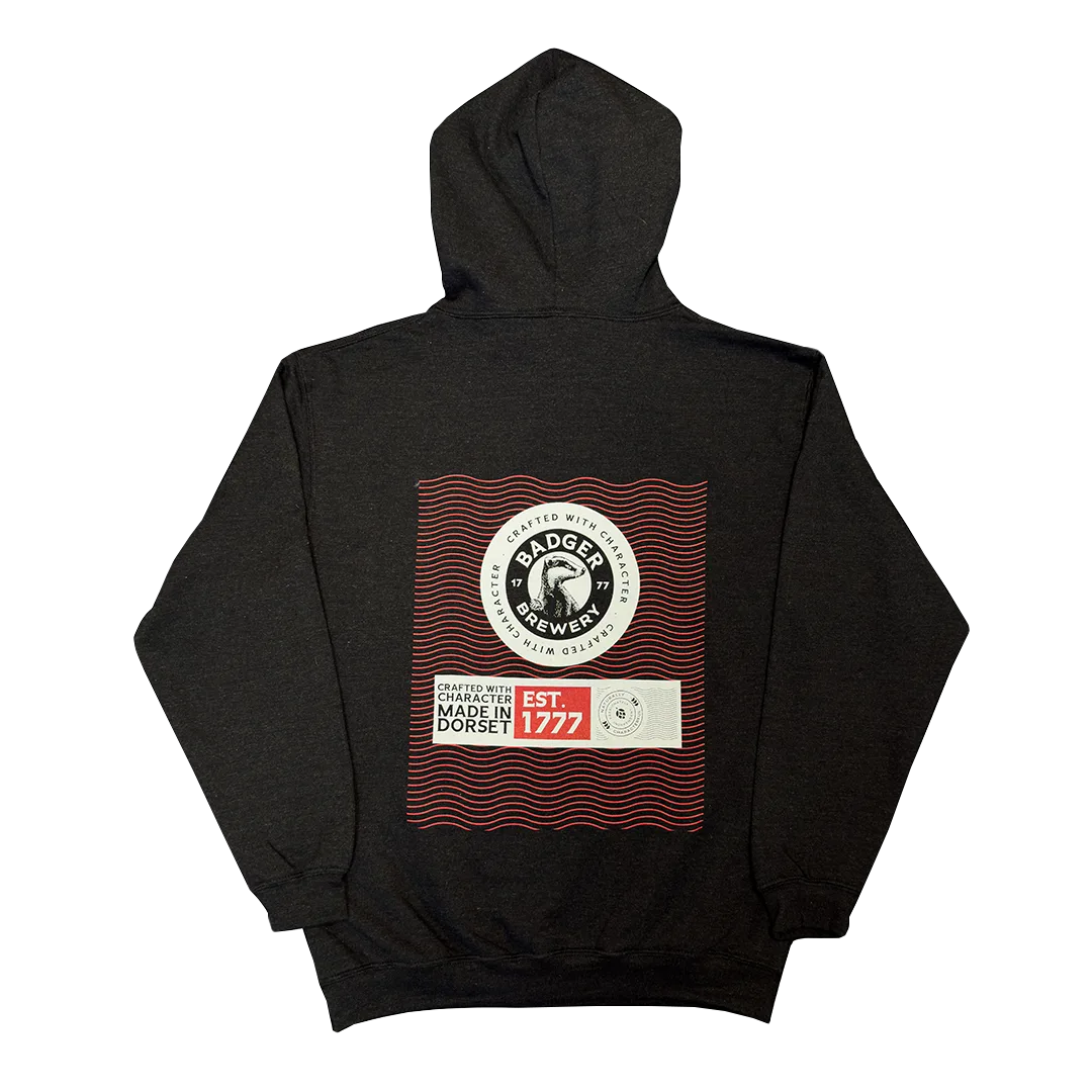 Back of the dark grey flecked Badger hoodie showing the Est. 1777 Crafted with Character print