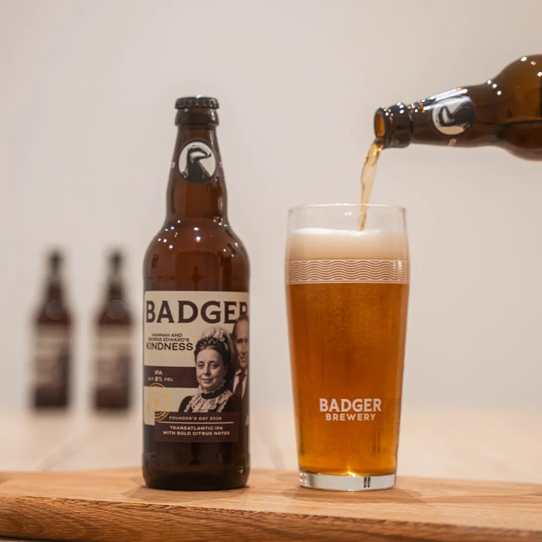 Hannah and George Edward's Kindness IPA poured from the bottle into a Badger glass