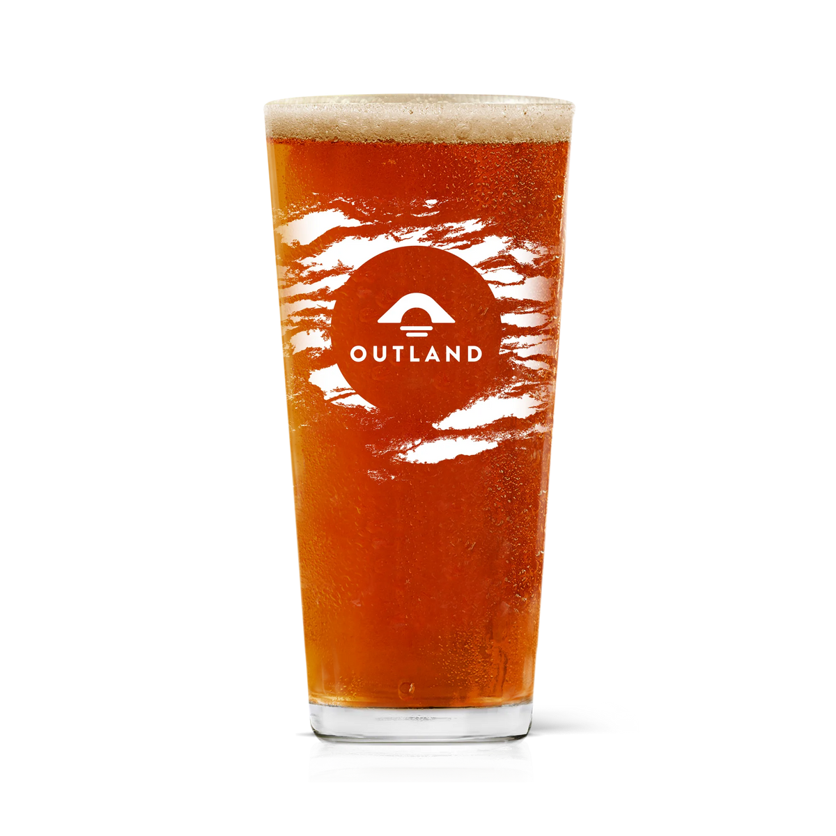 Outland pint glass filled with amber beer, printed with the Outland mountain logo
