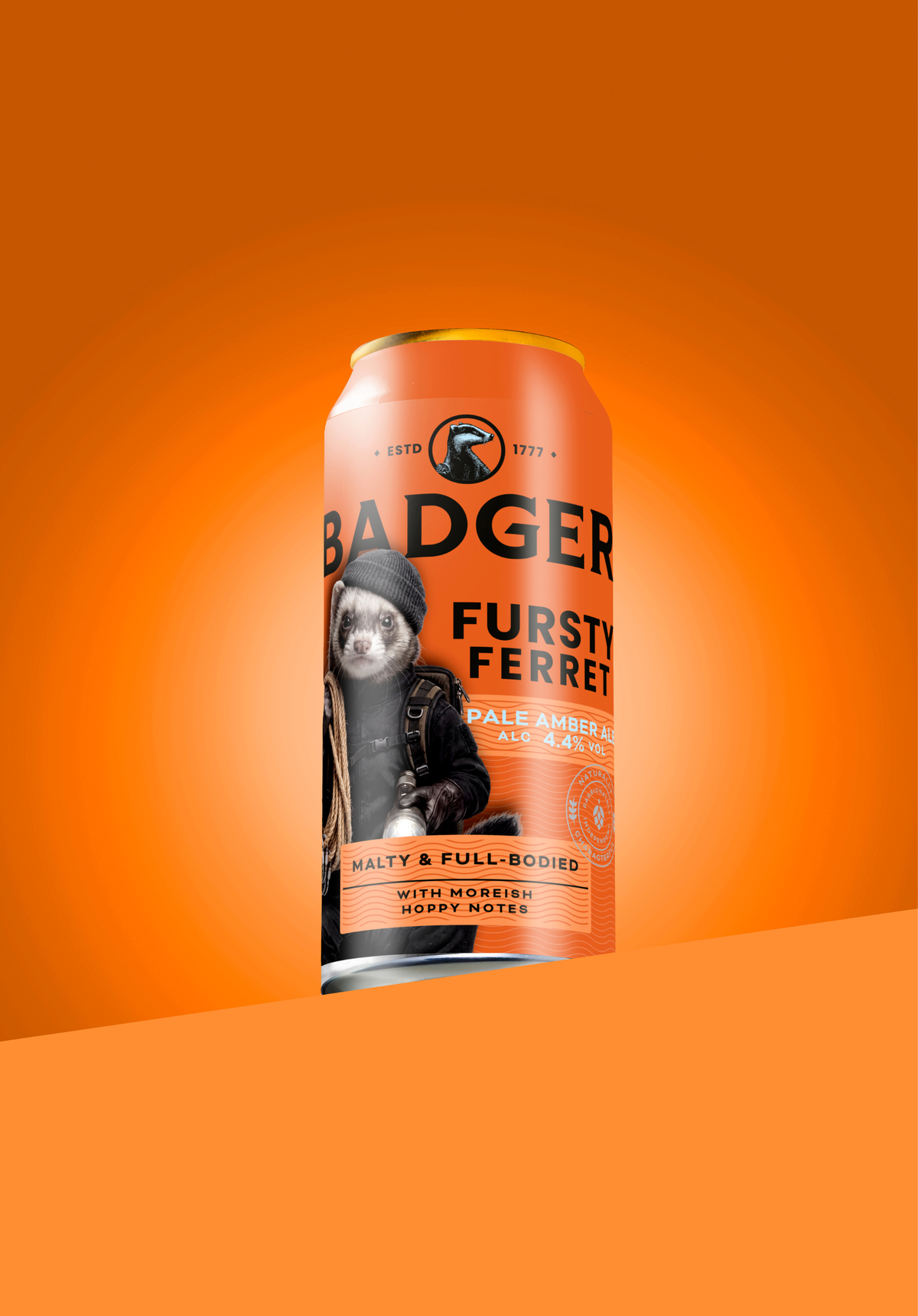 Can of Badger Fursty Ferret pale amber ale on a bright orange background