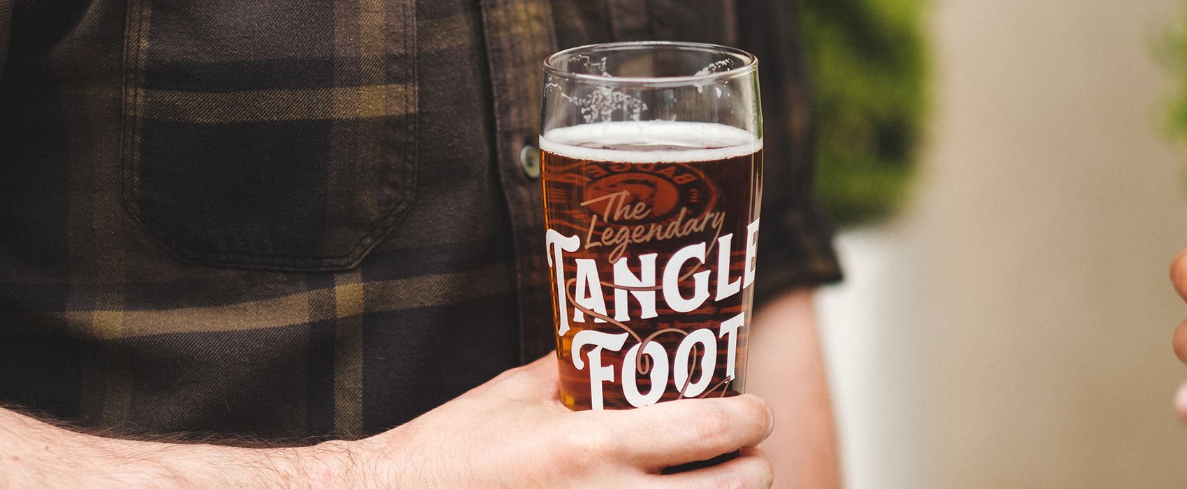 Enjoying a pint of Tangle Foot beer