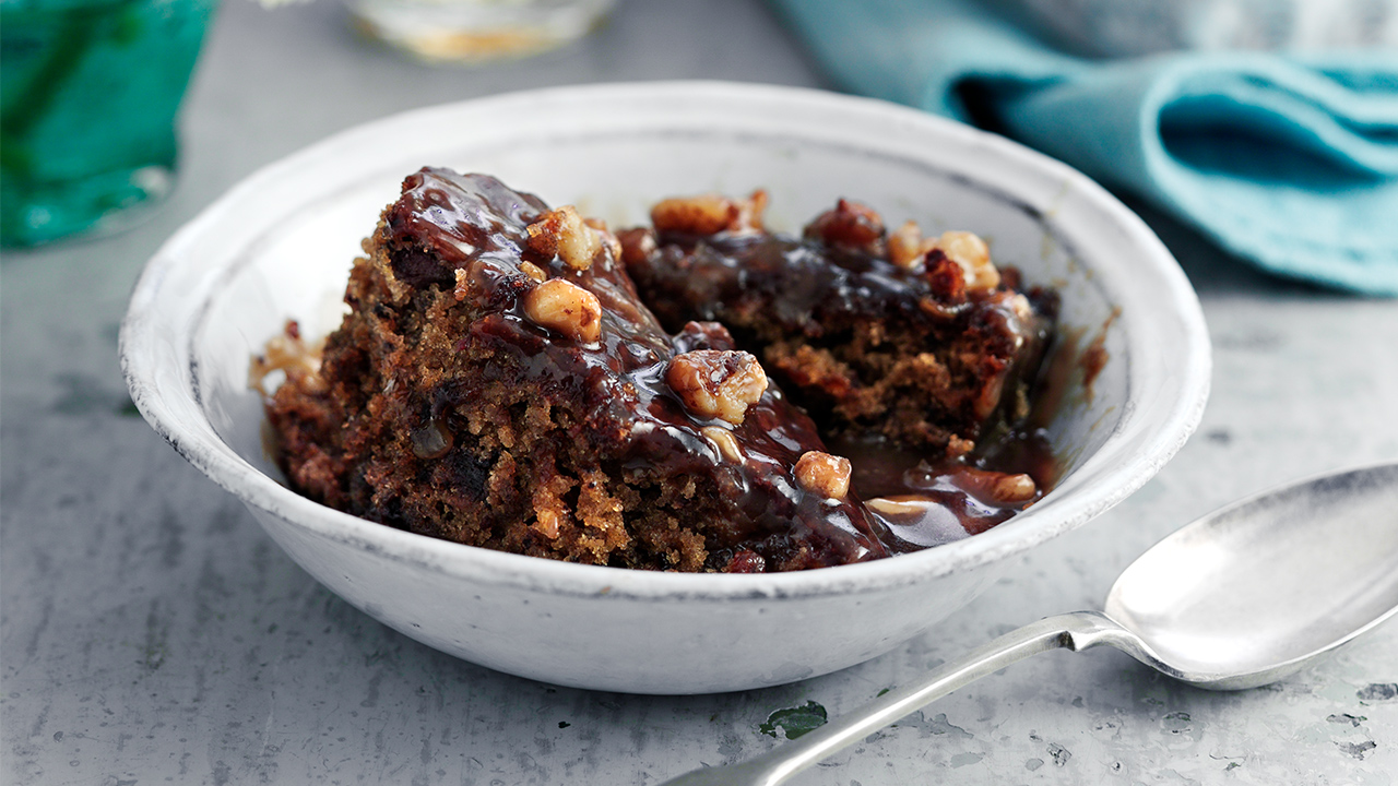 A bowl of sticky toffee pudding made with a special recipe adding a ginger twist