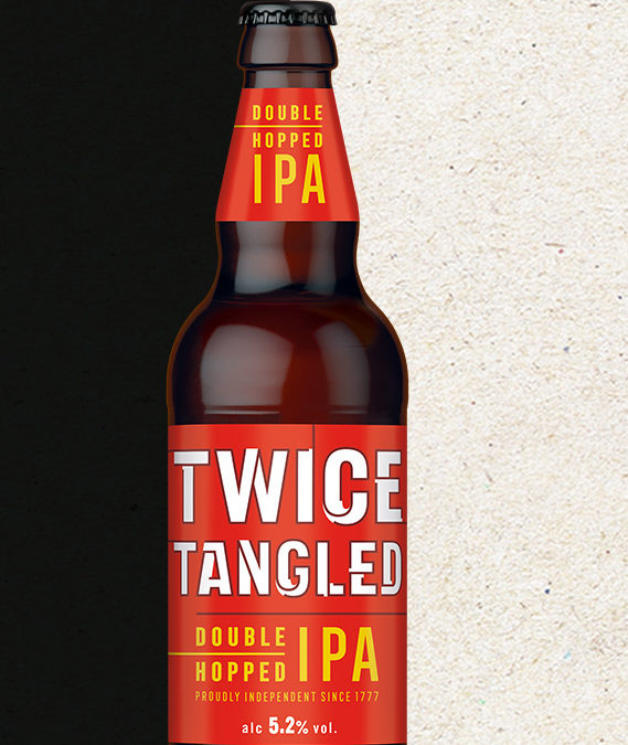 Close up of labels on a bottle of Twice Tangled double hopped IPA