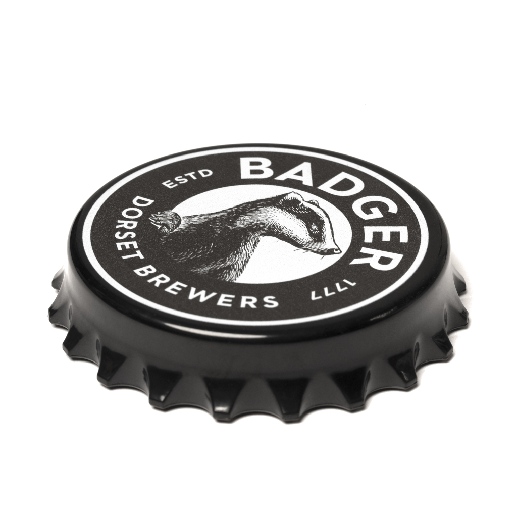 A fridge magnet with the Badger Beers logo that looks like a bottle cap and works as a bottle opener