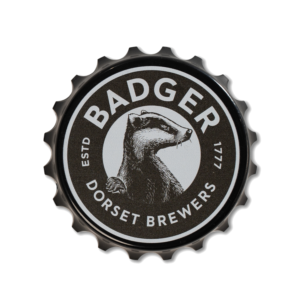 Top view of fridge magnet bottle opener in black with the Badger Beers logo