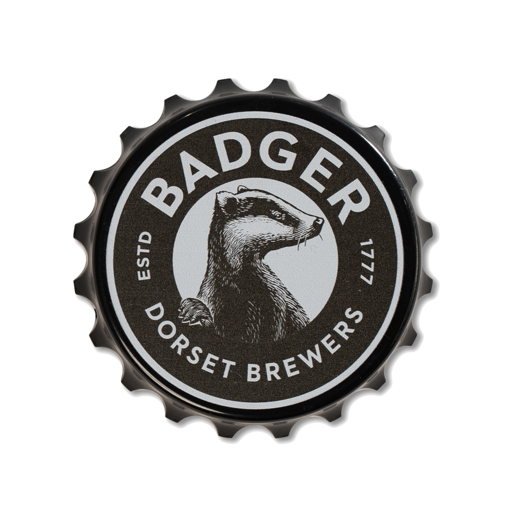 Top view of fridge magnet bottle opener in black with the Badger Beers logo