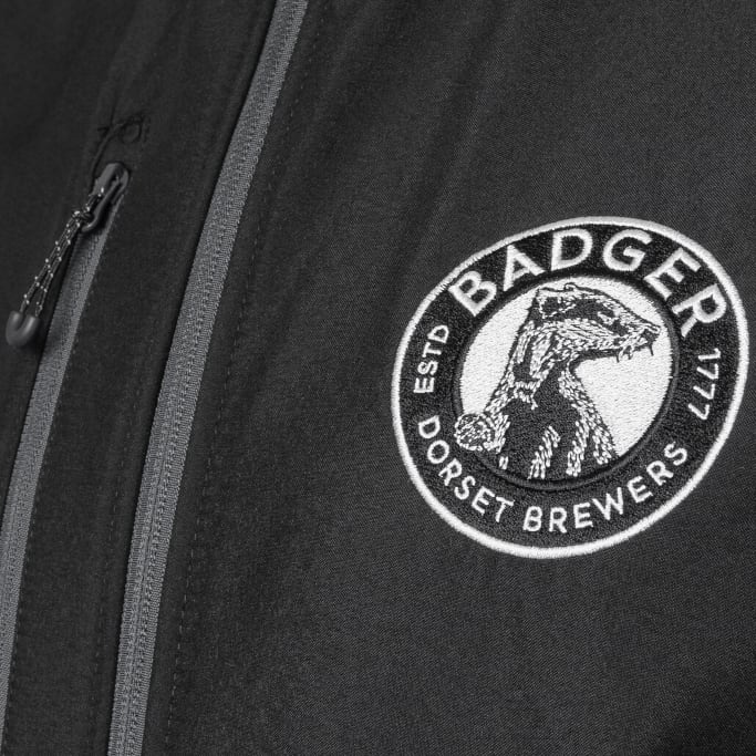 Close up of logo badge patch on official Badger Beers Body Warmer