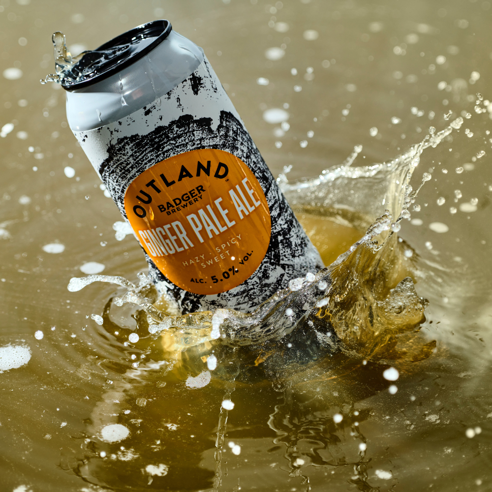 Outland Ginger Pale Ale splashing in beer