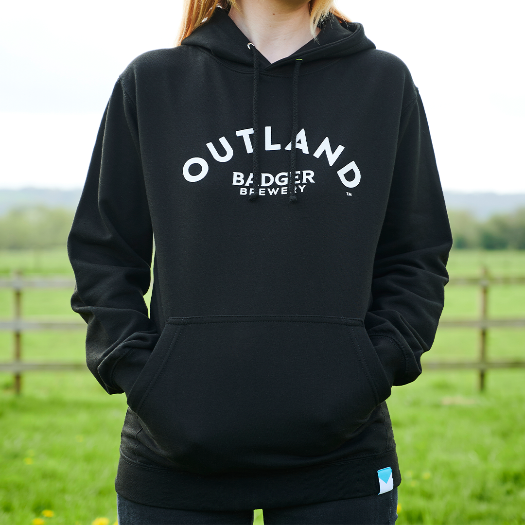 Person wearing Outland Black Hoodie (Front)