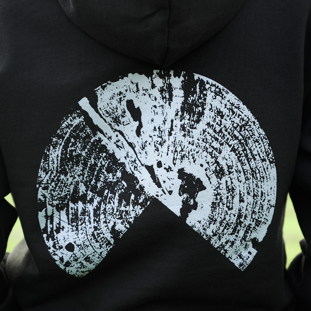 Person wearing Outland Black Hoodie (Back Up Close)