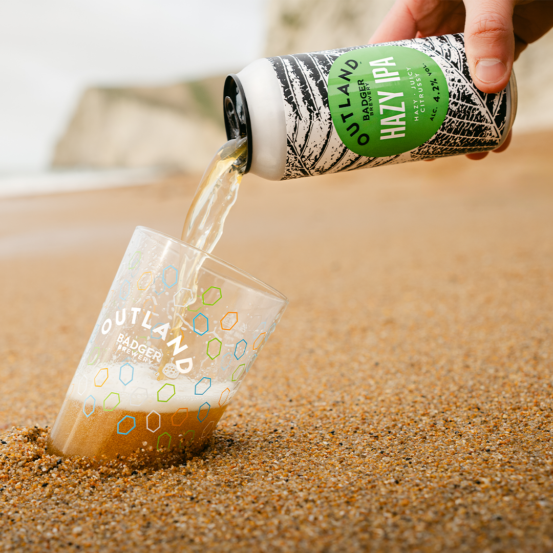 Outland Hazy IPA pour on beach