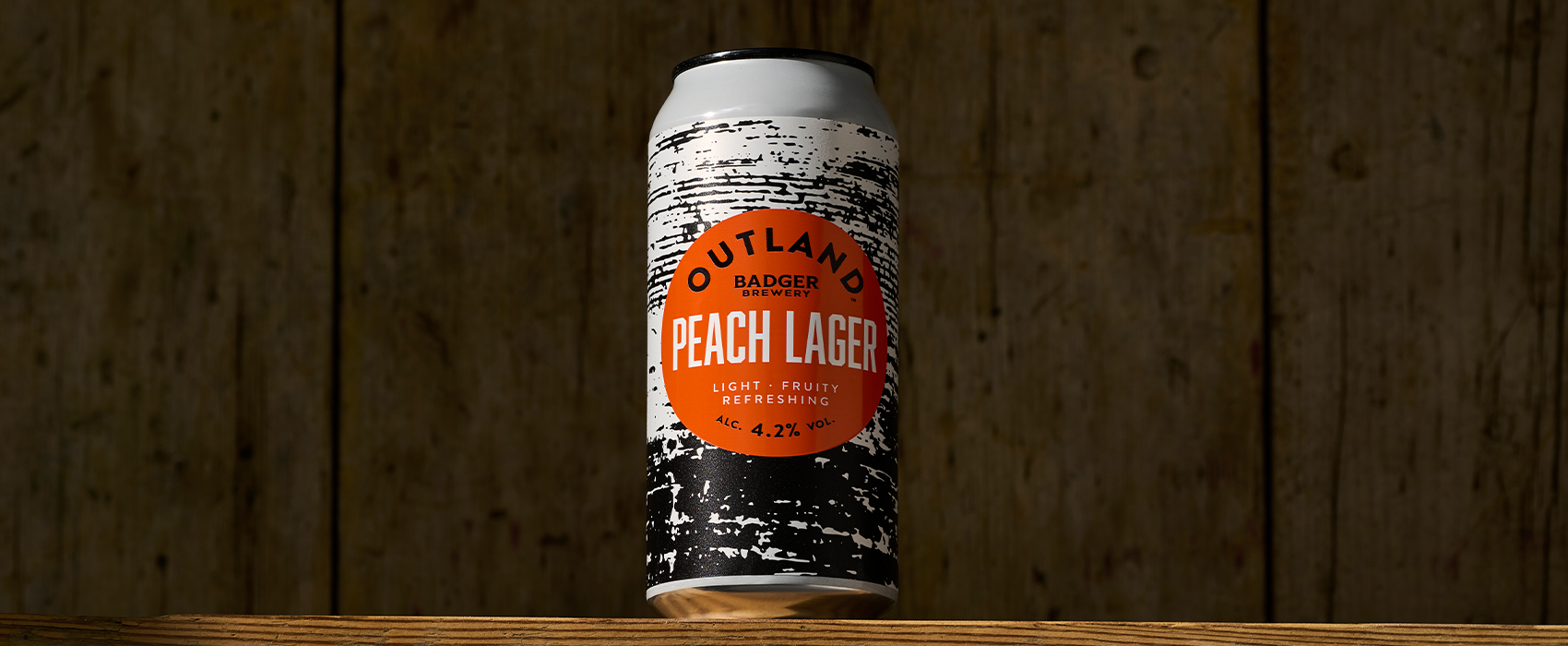 Outland by Badger Brewery Peach Lager cans